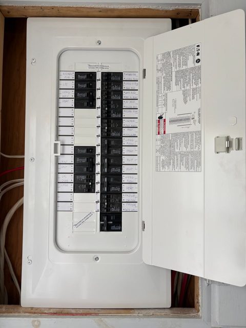 Labeled Eaton electrical panel after residential upgrade by Acadian Coast Electric